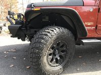 Front driver's side tire rim hood bumper.jpg